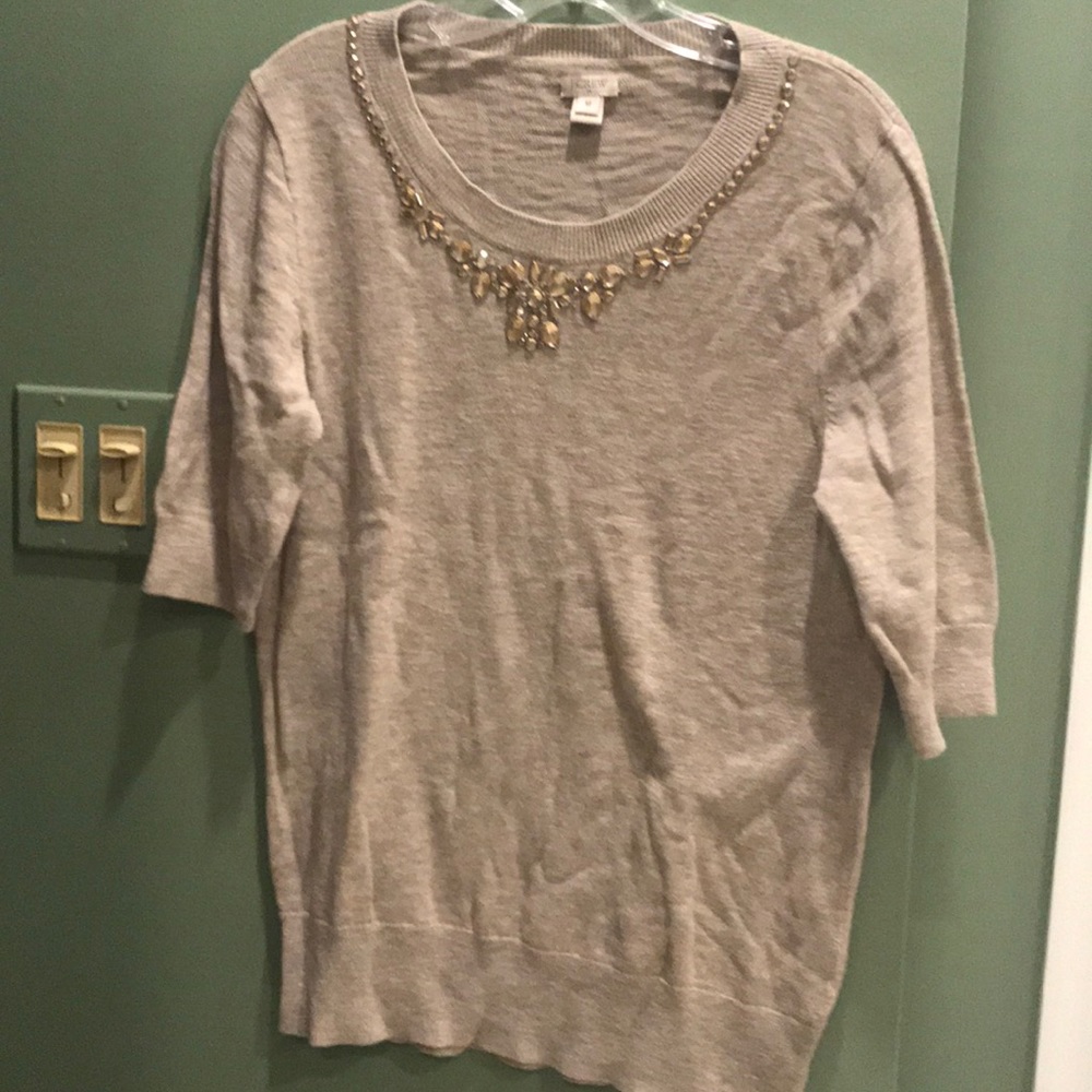 Jeweled neckline 3/4 sleeve sweater.
